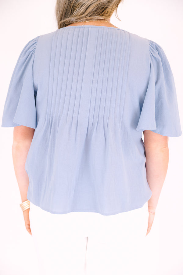 Chic Soul plus size clothing, light dusty blue short flutter sleeve top with v neck cutout and a drawstring bow tying across the cutout
