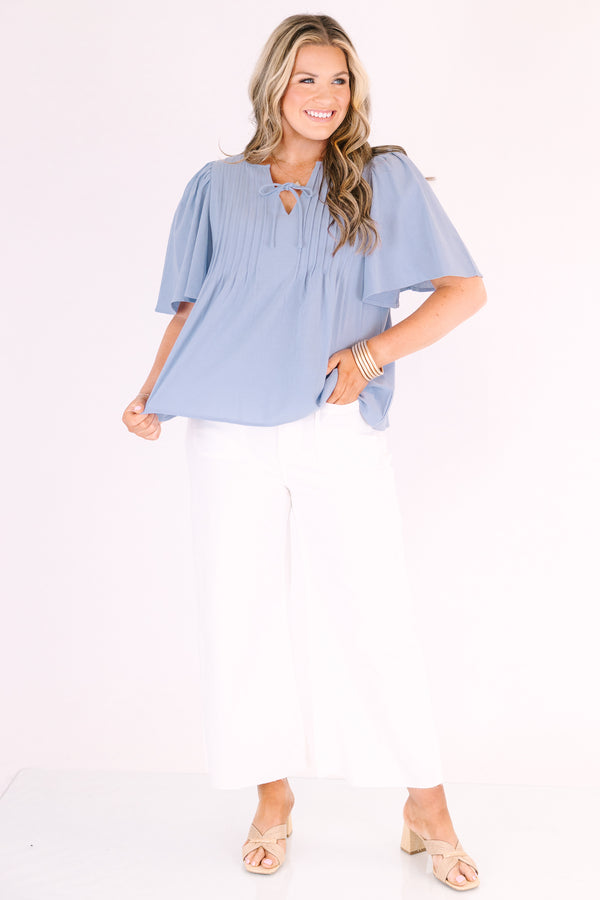 Chic Soul plus size clothing, light dusty blue short flutter sleeve top with v neck cutout and a drawstring bow tying across the cutout