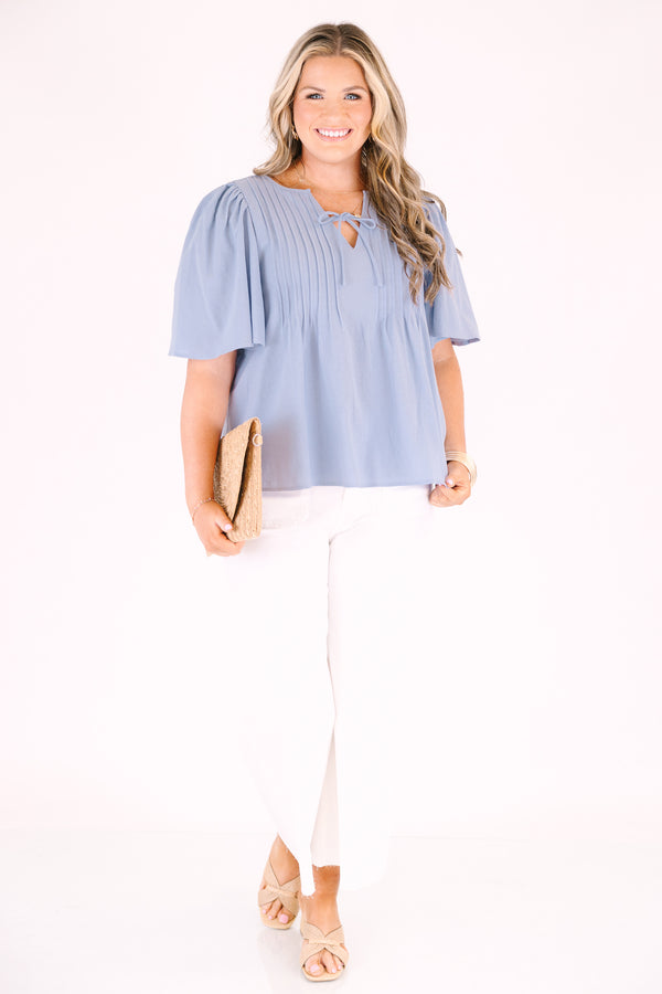 Chic Soul plus size clothing, light dusty blue short flutter sleeve top with v neck cutout and a drawstring bow tying across the cutout