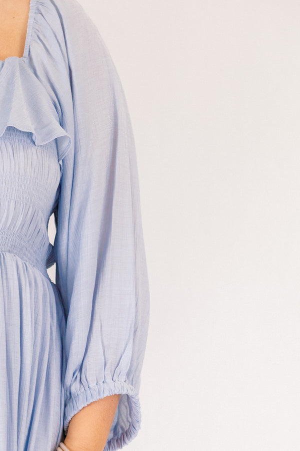Chic Soul plus size clothing, light blue long sleeve square neck maxi dress with smocking and a ruffle along the neckline and a tie in the center of the chest