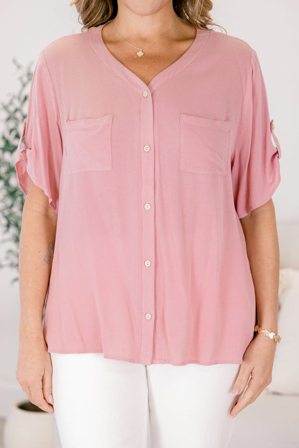 Chic Soul plus size clothing, a button up short sleeve top in dusty pink featuring pockets on both sides of the front chest and a small button detail securing the short sleeves 