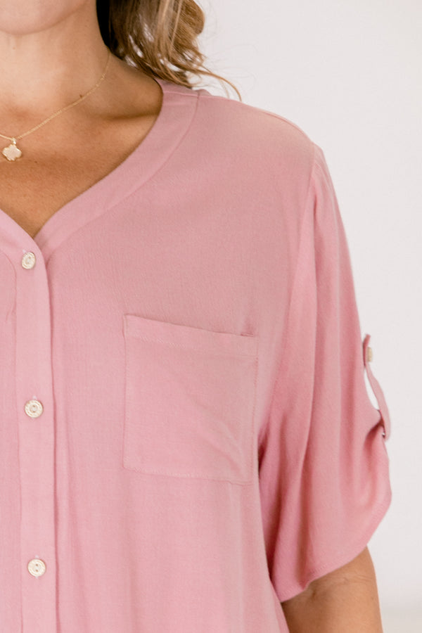 Chic Soul plus size clothing, a button up short sleeve top in dusty pink featuring pockets on both sides of the front chest and a small button detail securing the short sleeves 