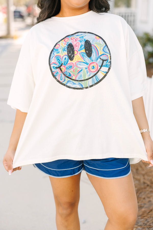 Chic Soul plus size clothing, ivory white short sleeve boyfriend tee with black outline of smiley face on the front and retro colorful flower pattern inside smiley face