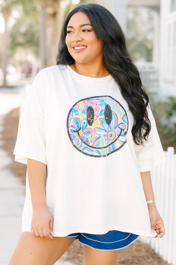 Chic Soul plus size clothing, ivory white short sleeve boyfriend tee with black outline of smiley face on the front and retro colorful flower pattern inside smiley face
