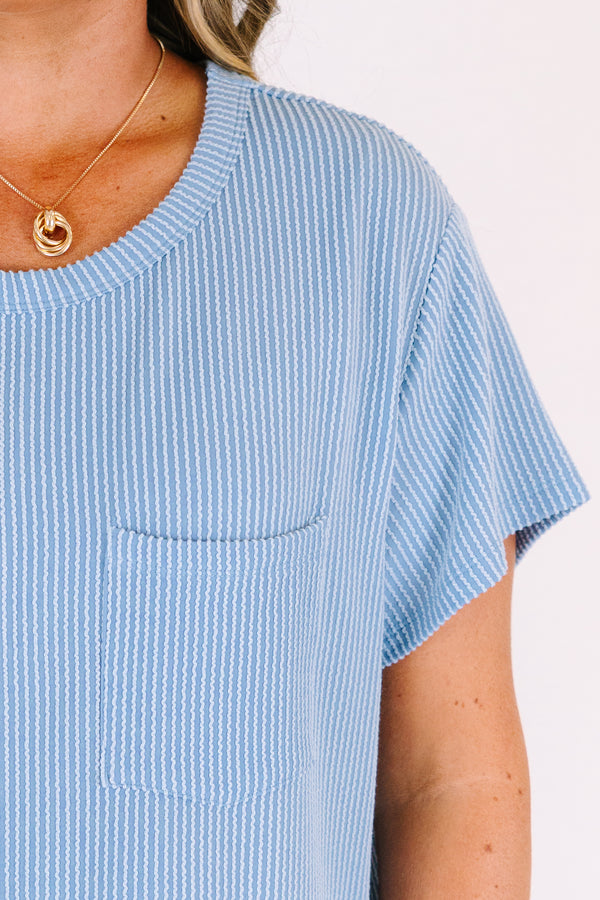 Short sleeve dusty blue top with ribbed details and front pocket