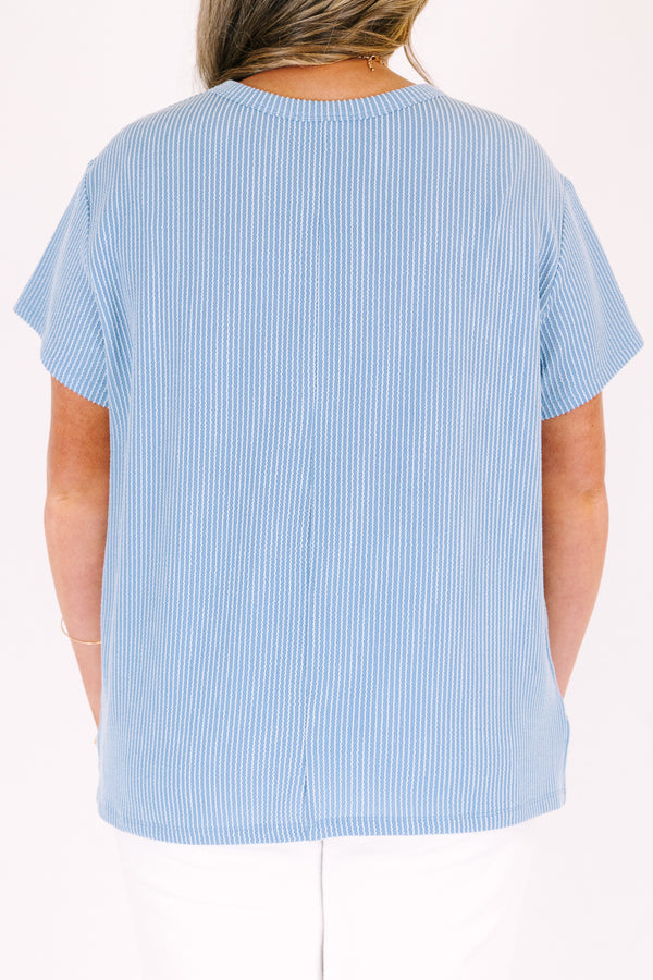 Short sleeve dusty blue top with ribbed details and front pocket