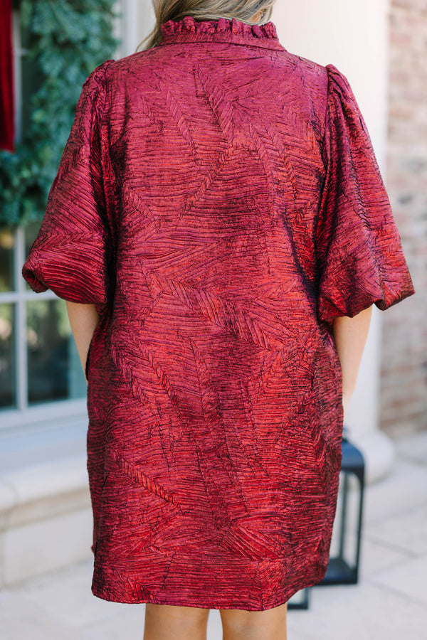 Plus Size red textured metallic dress with a smocked yoke, V-neckline, and puff sleeves.
