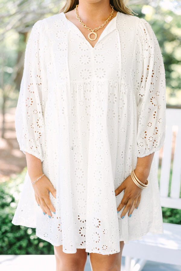 Chic Soul plus size clothing, white eyelet long sleeve babydoll dress with v neckline and tassels hanging from the collar
