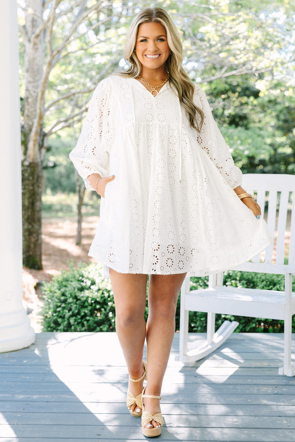 Chic Soul plus size clothing, white eyelet long sleeve babydoll dress with v neckline and tassels hanging from the collar
