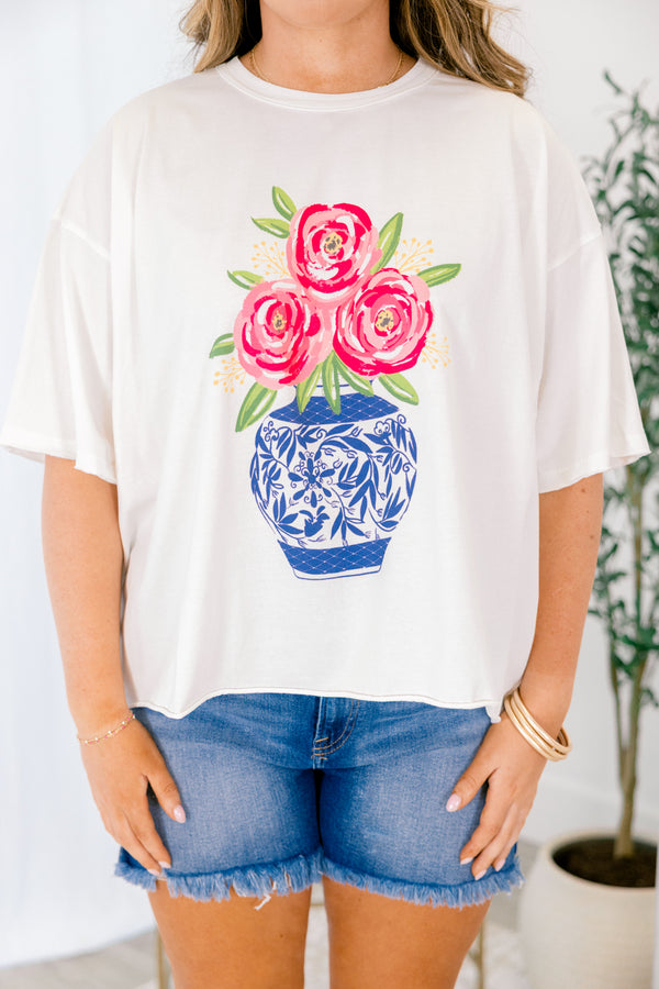 Chic Soul plus size clothing, white short sleeve graphic tee with a blue Chinoiserie vase graphic that has pink flowers coming out of the vase that is surrounded by green leaves 
