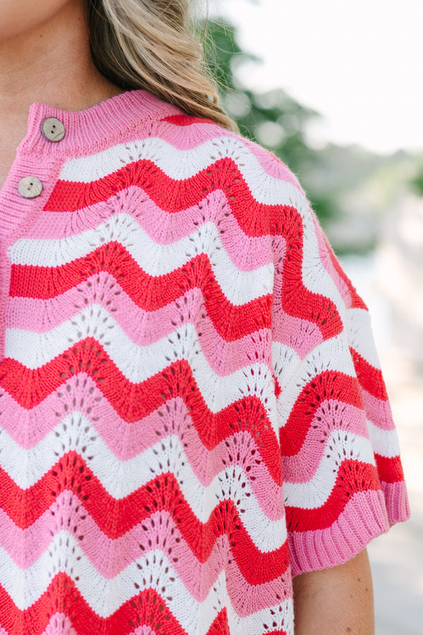 Chic soul plus size clothing, pink and red woven short set with a short sleeve top and both have a red and pink woven wavey pattern as well as the top having a button -up neckline 