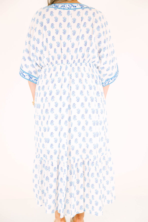 Chic Soul plus size clothing, cerulean blue maxi dress with short sleeves that have a floral pattern cuffed as well as a floral pattern outlining the v-neckline and a floral block pattern throughout