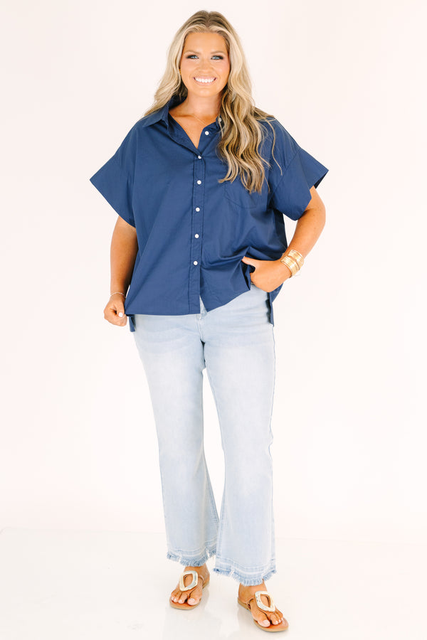Plus Size light wash flare jeans with a high-rise fit and frayed raw hems.