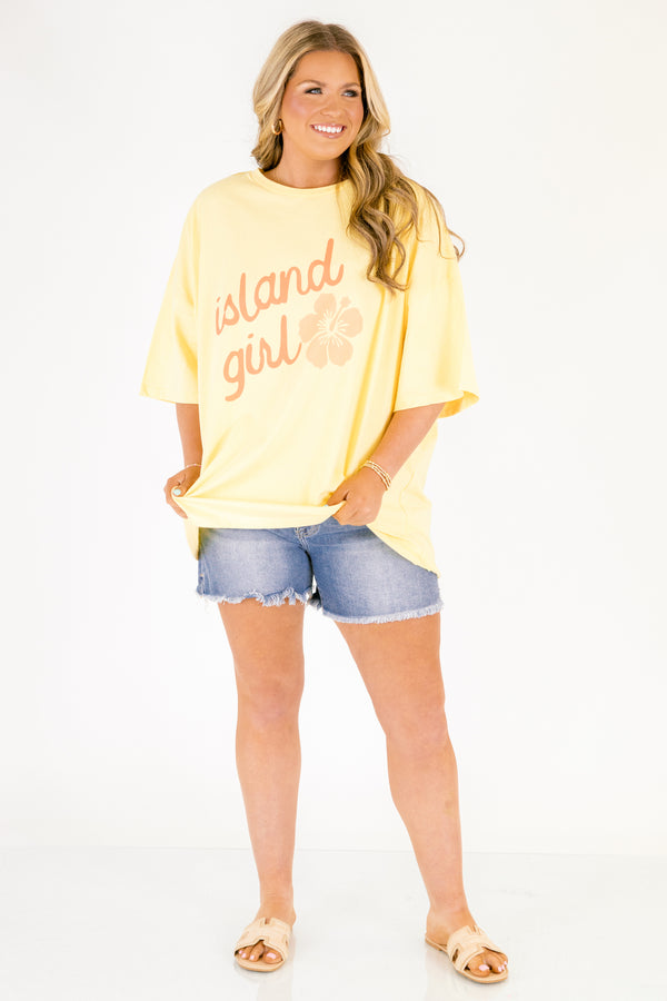 Chic Soul plus size clothing, butter yellow short sleeve oversized tee with “island girl” text in script font with a flower off to the side