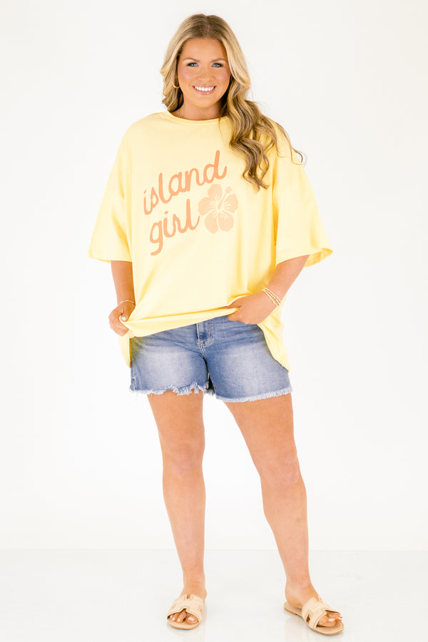 Chic Soul plus size clothing, butter yellow short sleeve oversized tee with “island girl” text in script font with a flower off to the side