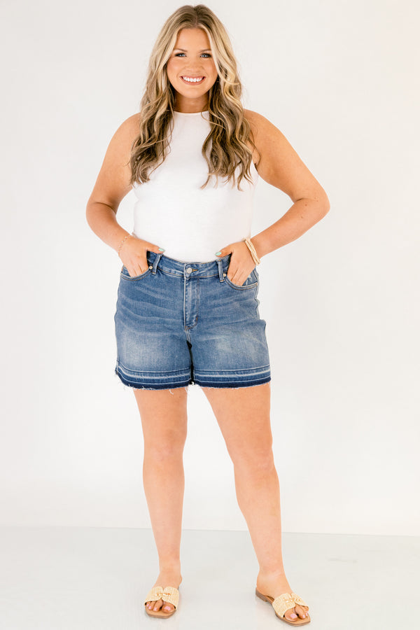 Chic Soul plus size clothing, dark washed jean shorts with front pockets and a distressed look as well as fringe details on the bottom of each short leg
