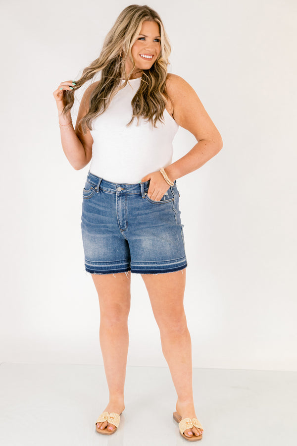 Chic Soul plus size clothing, dark washed jean shorts with front pockets and a distressed look as well as fringe details on the bottom of each short leg