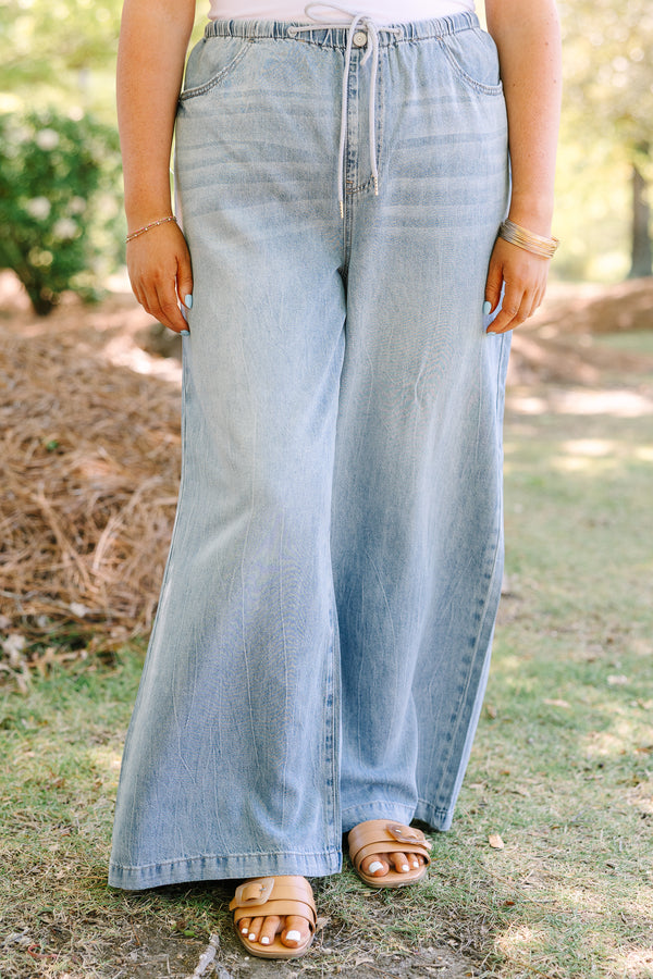 Chic soul plus size clothing, light wash loose fit flare jeans with front pockets and a draw string waistband 
