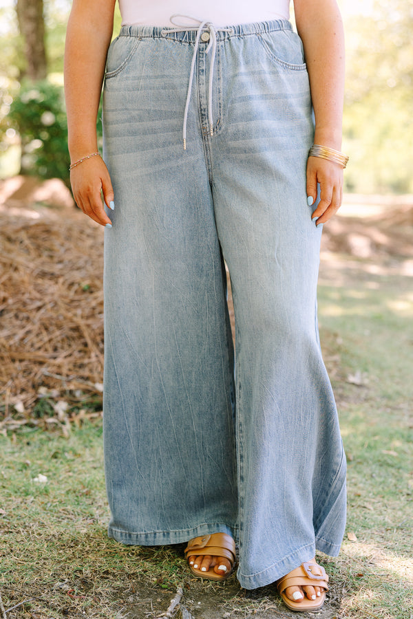 Chic soul plus size clothing, light wash loose fit flare jeans with front pockets and a draw string waistband 
