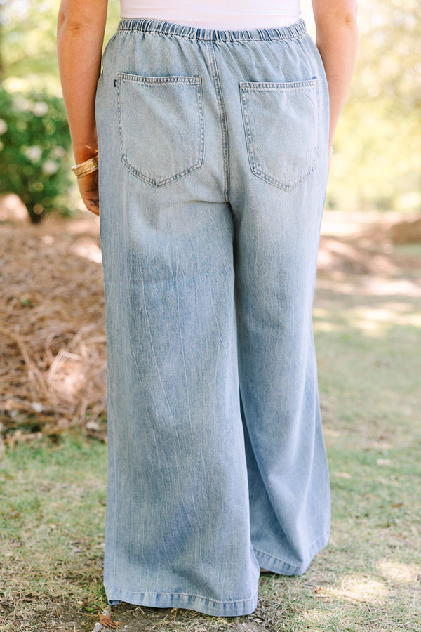 Chic soul plus size clothing, light wash loose fit flare jeans with front pockets and a draw string waistband 
