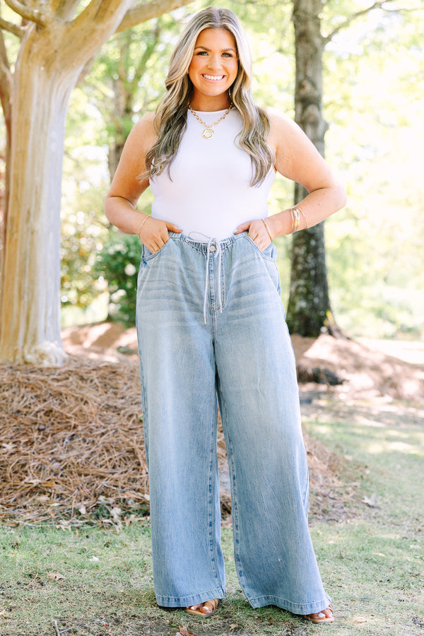 Chic soul plus size clothing, light wash loose fit flare jeans with front pockets and a draw string waistband 
