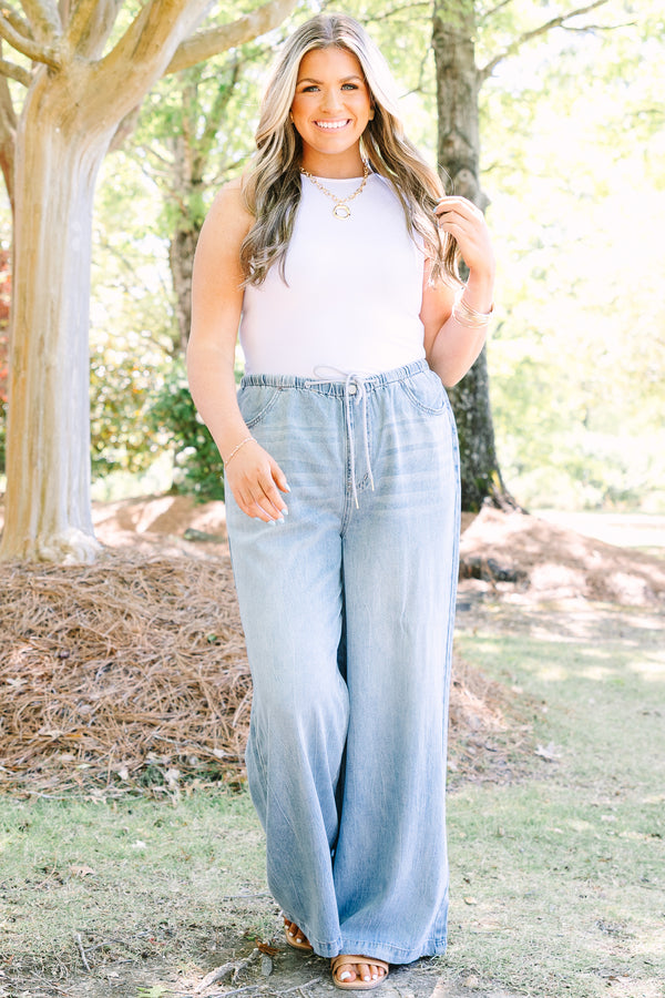 Chic soul plus size clothing, light wash loose fit flare jeans with front pockets and a draw string waistband 
