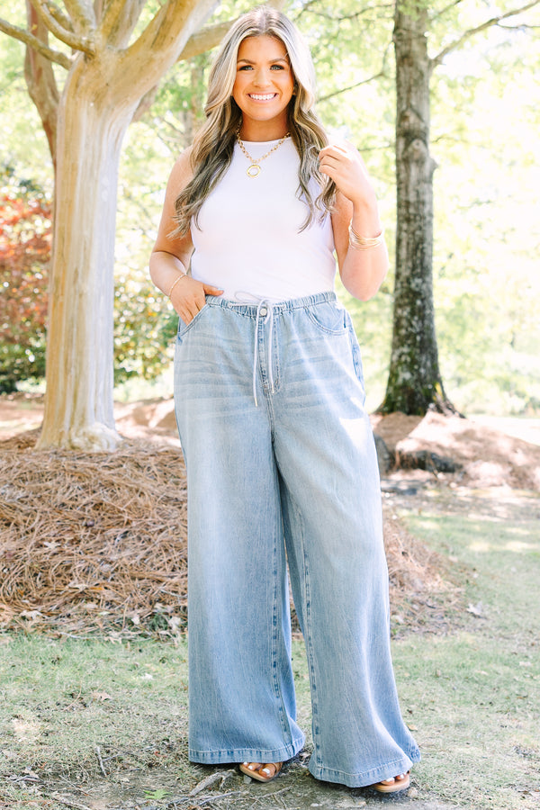 Chic soul plus size clothing, light wash loose fit flare jeans with front pockets and a draw string waistband 
