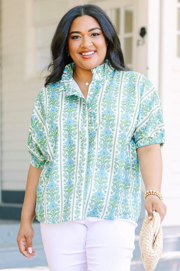 Blue floral stripe top with a ruffle collar, button-front ruffle trim, and  bubble sleeves.