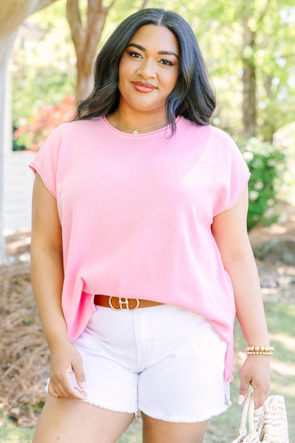 Plus size lightweight pink knit sweater with cap sleeves and a relaxed fit.