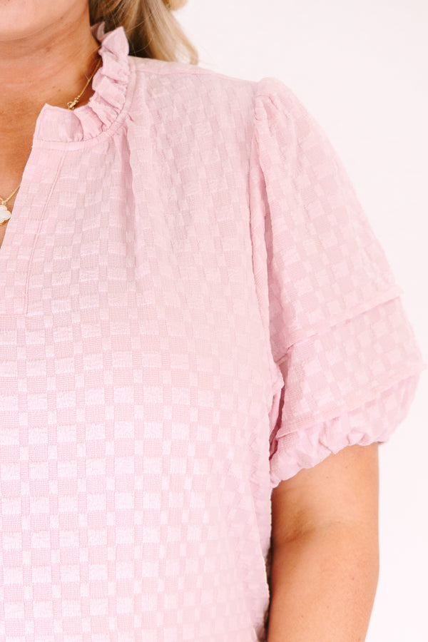 Chic Soul plus size clothing, pink top with short bubble sleeves a slight v-neckline as well as a ruffle collar and a subtle square pattern throughout
