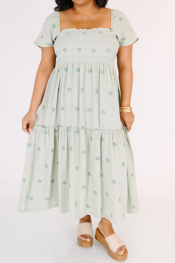 Chic Soul plus size clothing,  green maxi dress with a square neckline a smocked chest short sleeves and darker green floral embroidered pattern throughout