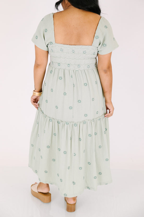Chic Soul plus size clothing,  green maxi dress with a square neckline a smocked chest short sleeves and darker green floral embroidered pattern throughout