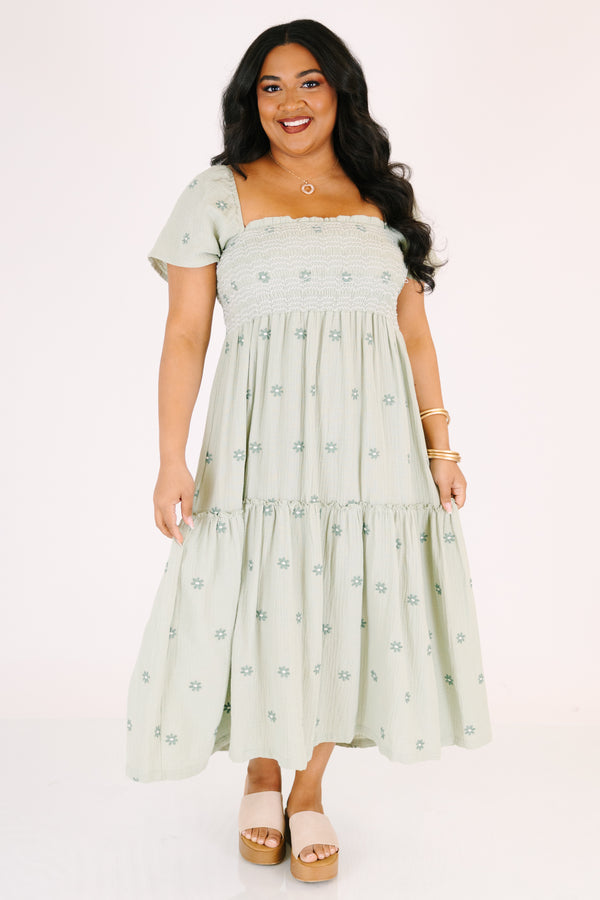 Chic Soul plus size clothing,  green maxi dress with a square neckline a smocked chest short sleeves and darker green floral embroidered pattern throughout
