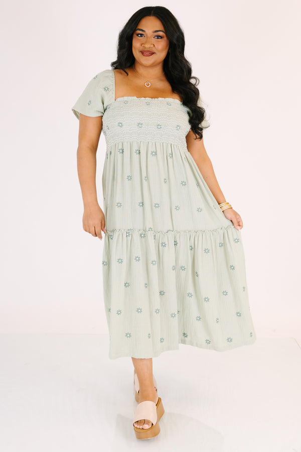 Chic Soul plus size clothing,  green maxi dress with a square neckline a smocked chest short sleeves and darker green floral embroidered pattern throughout
