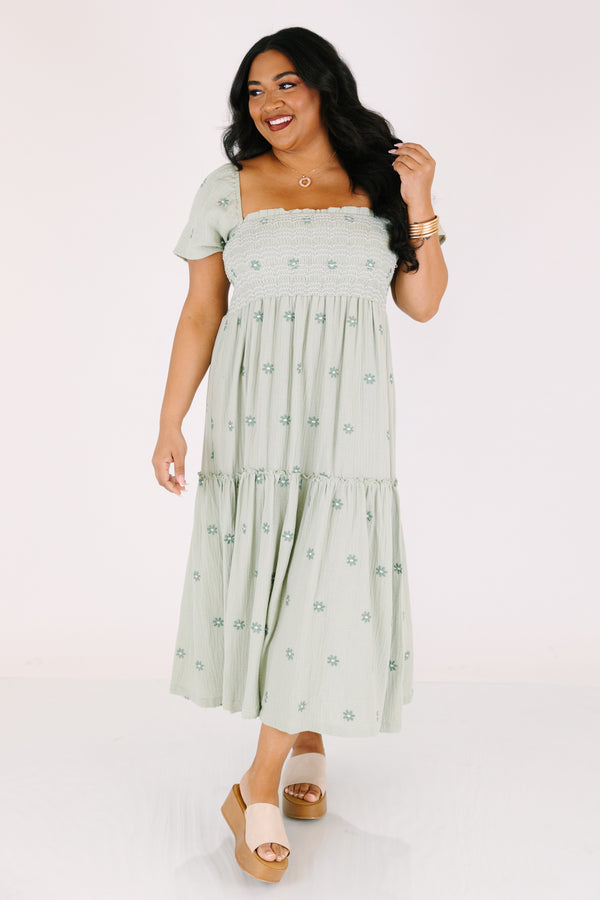Chic Soul plus size clothing,  green maxi dress with a square neckline a smocked chest short sleeves and darker green floral embroidered pattern throughout