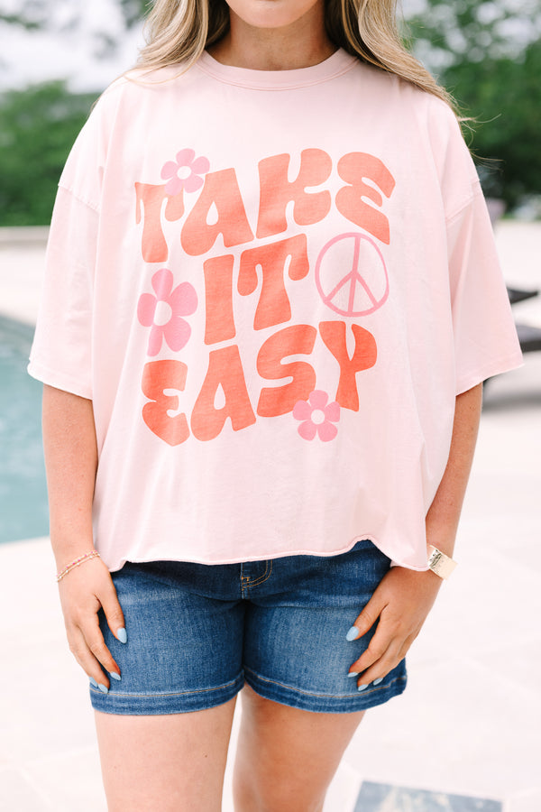 Plus Size blush pink vintage wash tee with a retro Take It Easy graphic and short sleeves.
