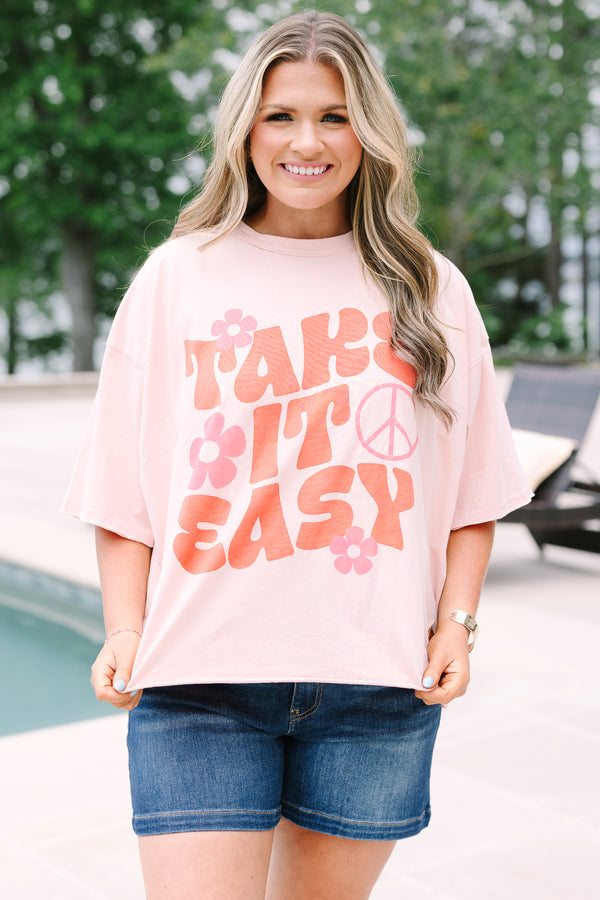Plus Size blush pink vintage wash tee with a retro Take It Easy graphic and short sleeves.