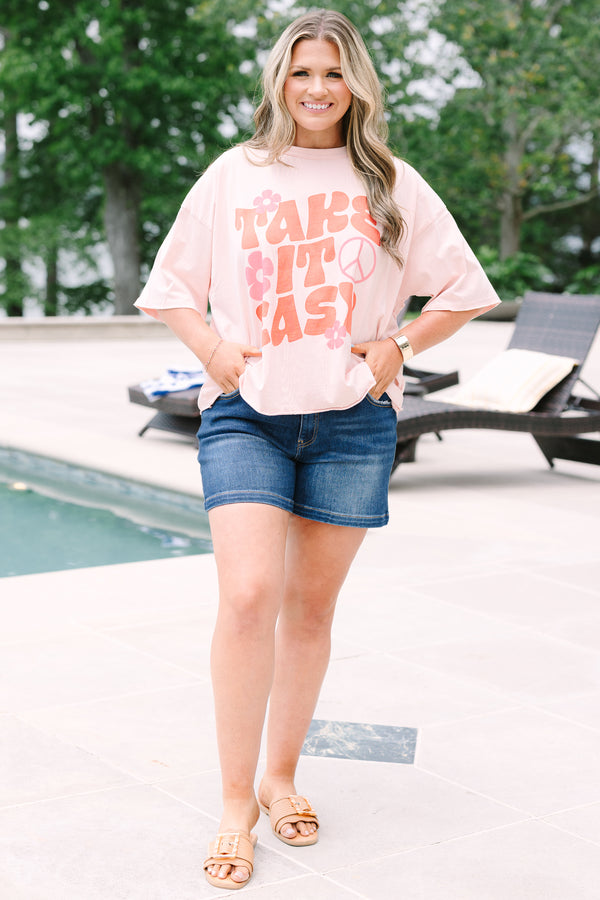 Plus Size blush pink vintage wash tee with a retro Take It Easy graphic and short sleeves.