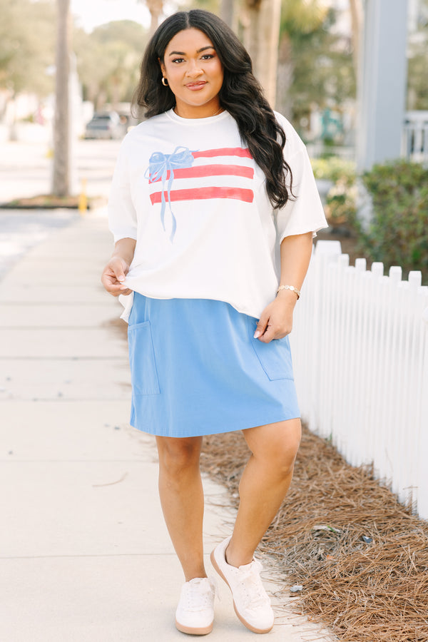 Chic Soul plus size clothing, white short sleeve slightly cropped tee with watercolor abstract American flag and light blue bow on it