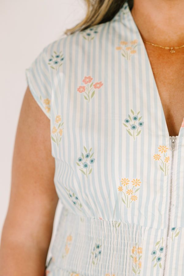 Chic Soul plus size clothing, light blue striped short sleeve maxi dress with with a zipper detail starting at the middle of the chest and going down to the knee as well as cinched stretchy waistband and a floral pattern throughout