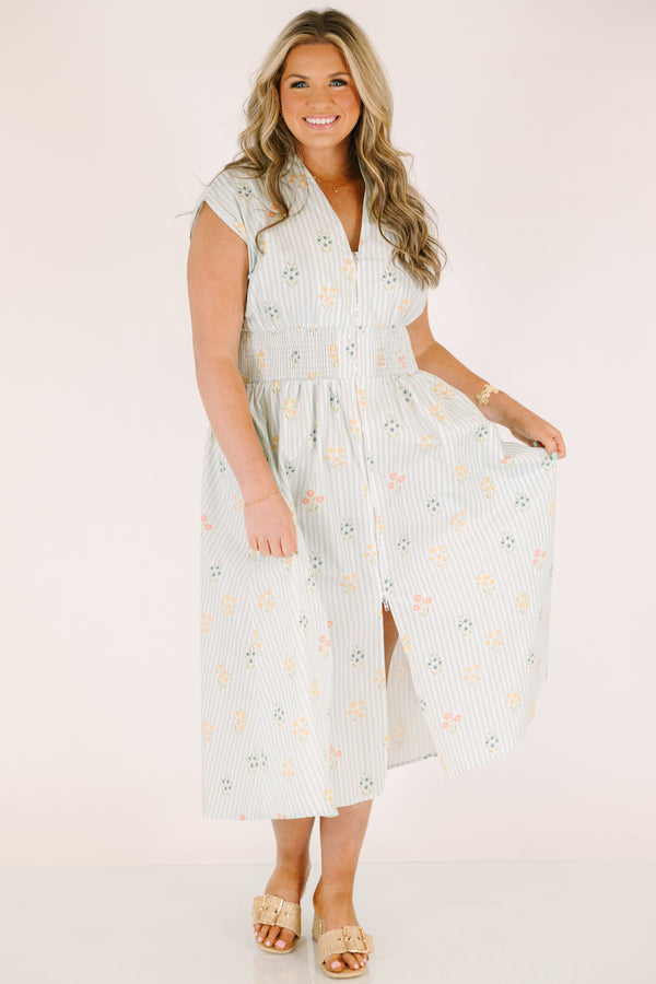 Chic Soul plus size clothing, light blue striped short sleeve maxi dress with with a zipper detail starting at the middle of the chest and going down to the knee as well as cinched stretchy waistband and a floral pattern throughout
