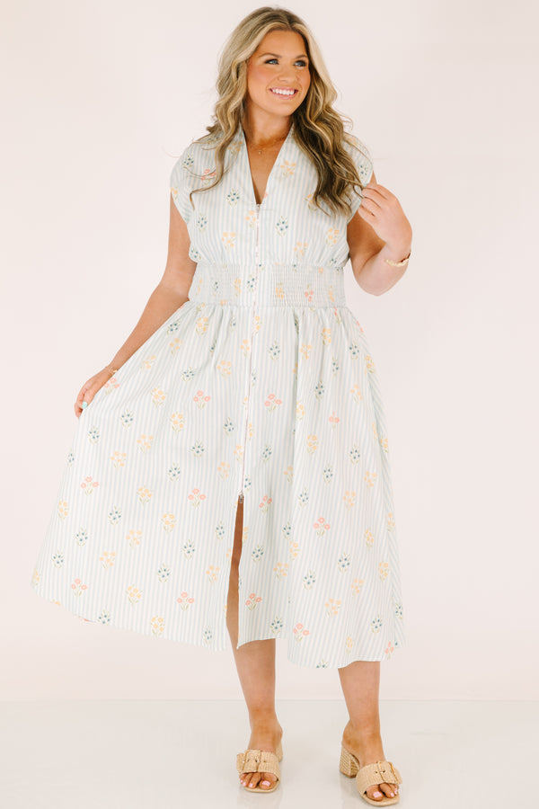 Chic Soul plus size clothing, light blue striped short sleeve maxi dress with with a zipper detail starting at the middle of the chest and going down to the knee as well as cinched stretchy waistband and a floral pattern throughout