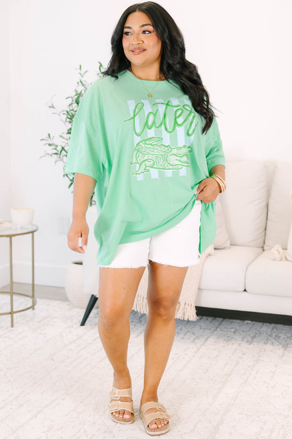 Plus Size mint green boyfriend tee with a Later Gator graphic and white denim shorts.