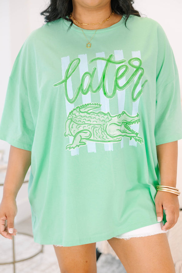 Plus Size mint green boyfriend tee with a Later Gator graphic and white denim shorts.