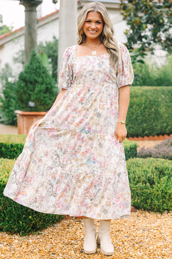 Plus Size pink floral tiered maxi dress with a square neckline and short puff sleeves.