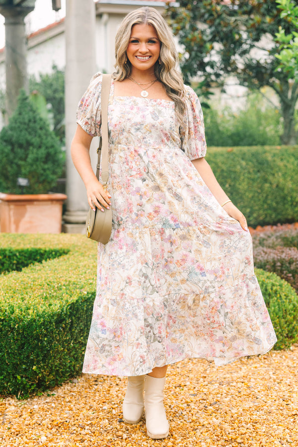 Plus Size pink floral tiered maxi dress with a square neckline and short puff sleeves.