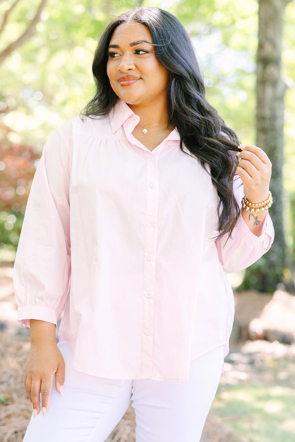 Light pink button-down cotton top with a classic collar and three-quarter length sleeves.