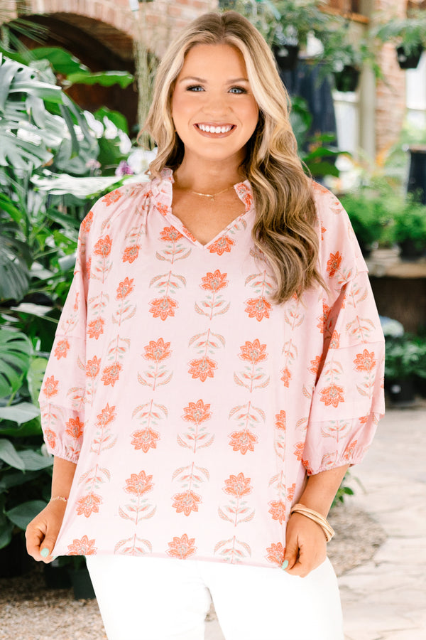 Chic Soul plus size clothing, pink top with half bubble sleeves and a slight v-neckline as well as a pink floral pattern throughout 