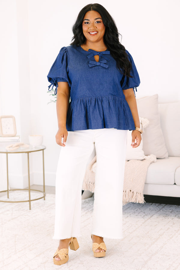 Plus Size denim peplum top with puff sleeves and double bow keyhole neckline.