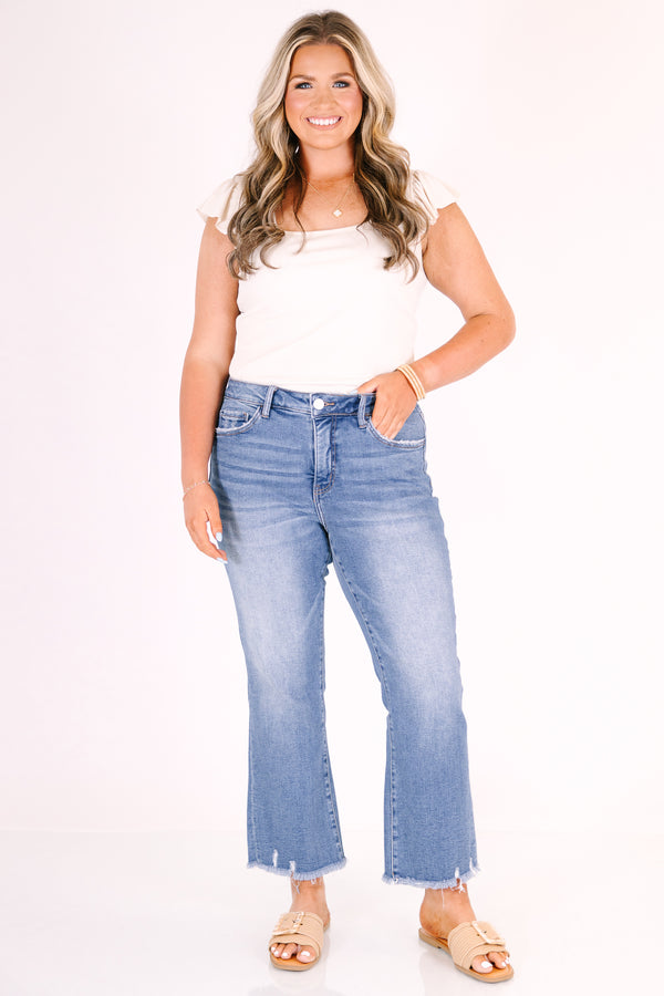 Chic Soul plus size clothing, medium wash ankle jeans with relaxed fit and distressed raw hem